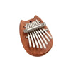 A wooden kalimba thumb piano with eight metal tines is shown on a light brown wooden board.