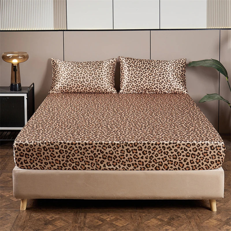 A bed dressed with luxury satin leopard print bedding set featuring brown and black animal print.