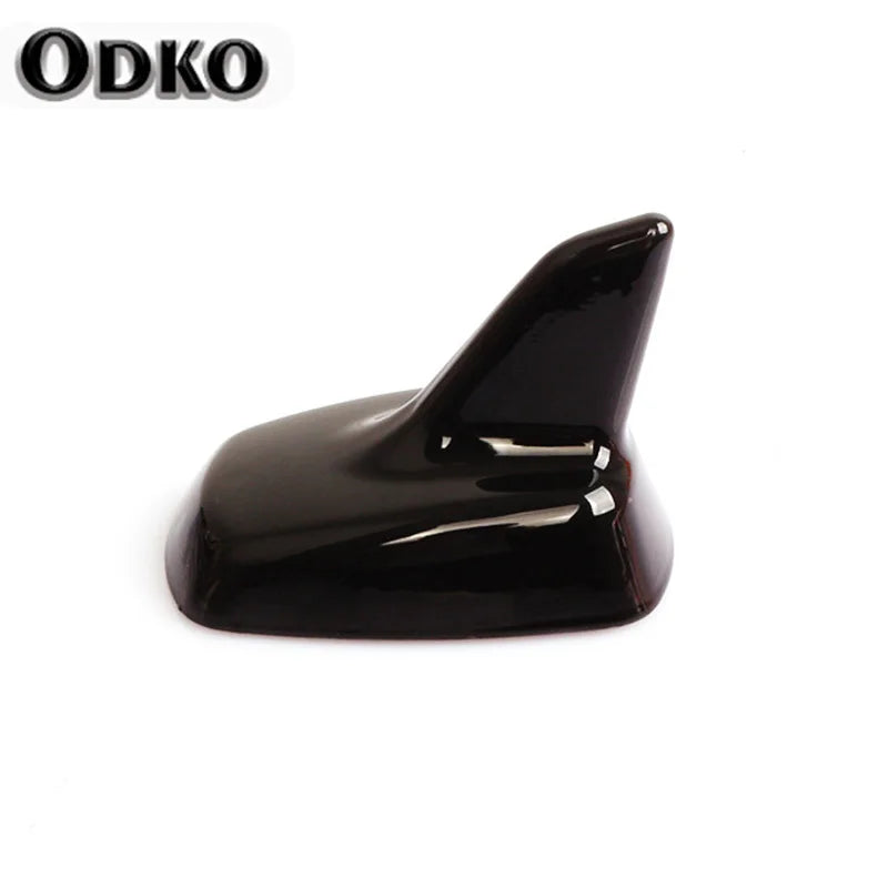 A sleek, black shark fin roof antenna for VW and Audi models.
