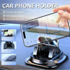 A hand holds a black car phone holder device designed for 360-degree rotation and features an automatic card slot.