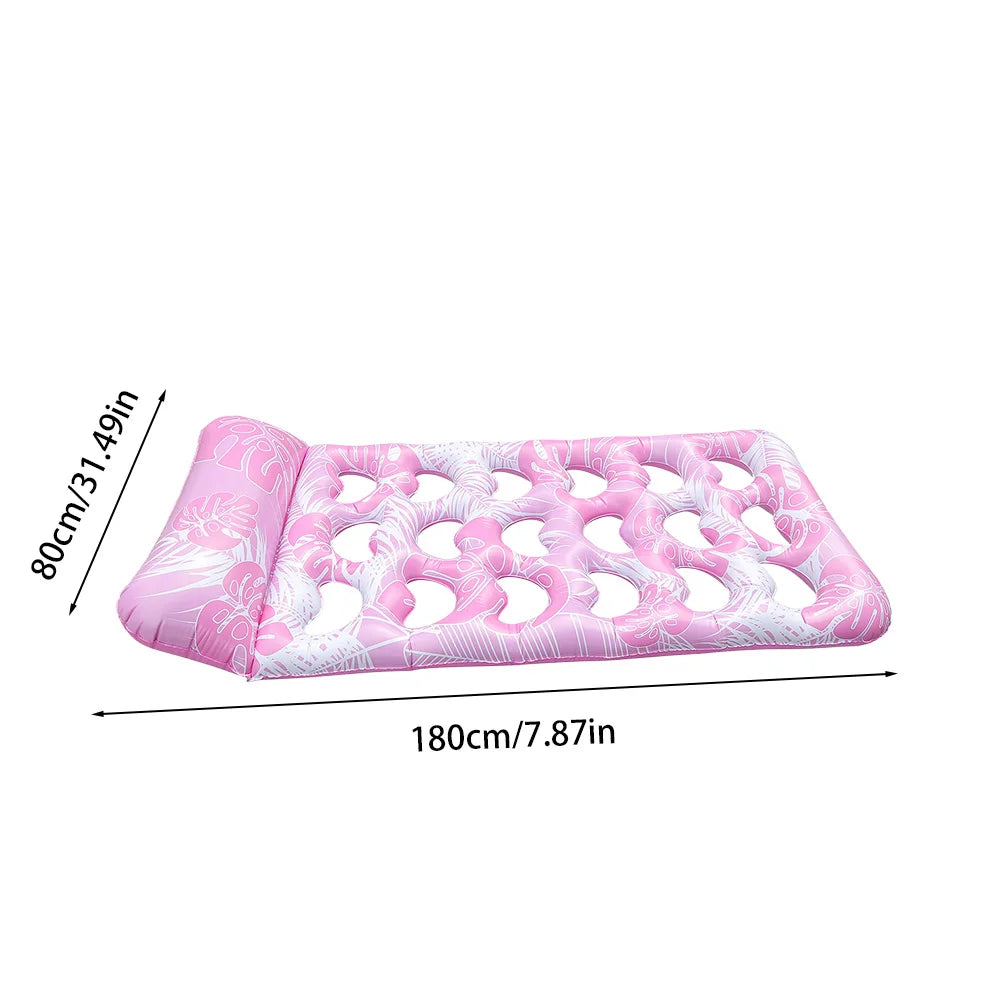 Pink inflatable pool float lounger with a headrest featuring a floral pattern