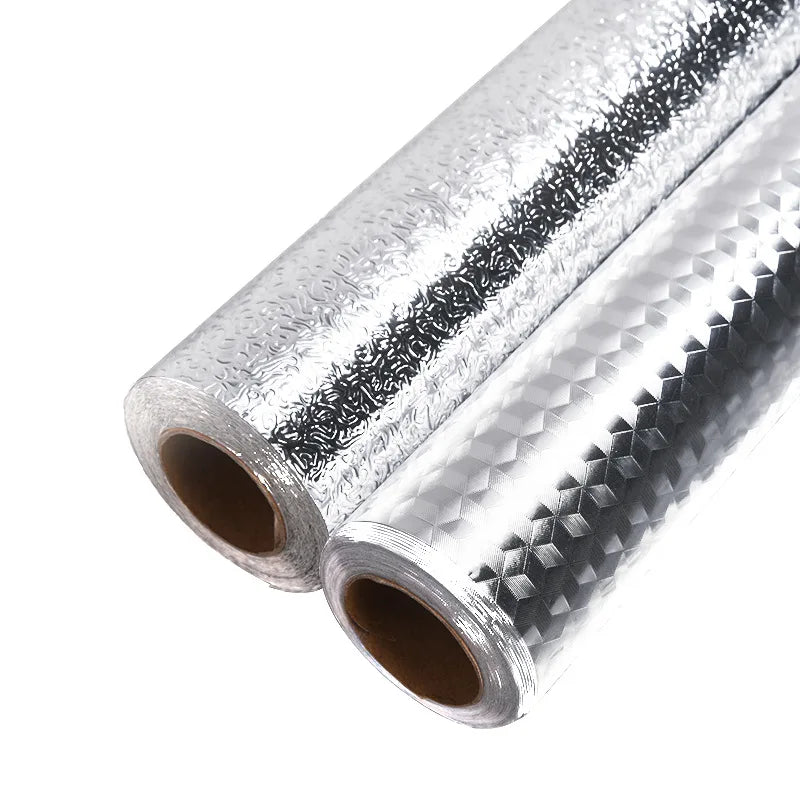 Roll of brushed silver peel-and-stick metal wallpaper with a textured surface