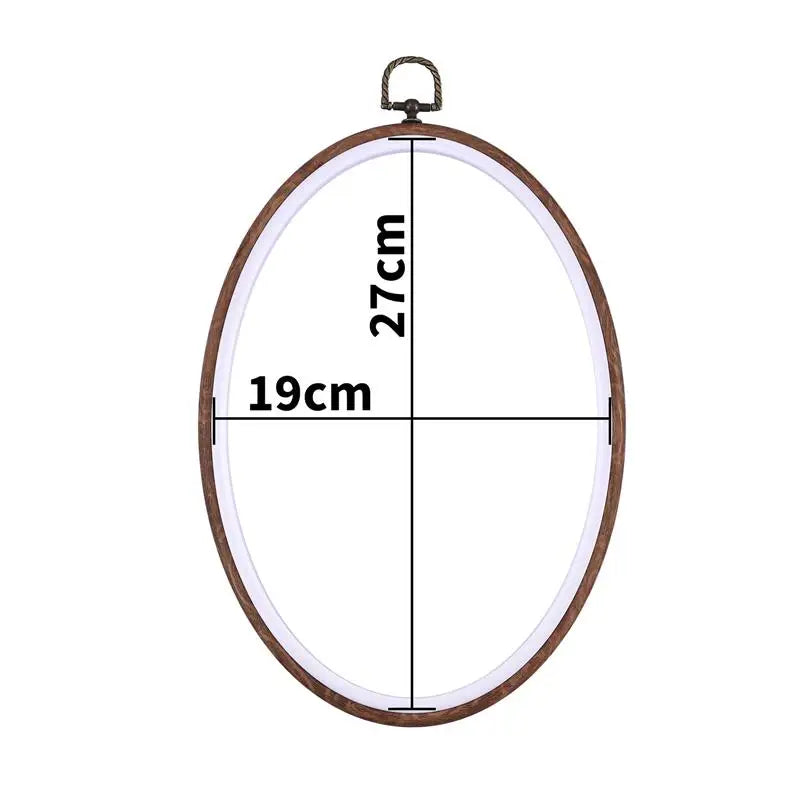 A round wooden embroidery hoop with a 19cm diameter and 27cm height, featuring a metal hook for use in cross-stitch or needle