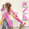 A girl is using a pink kids bow and arrow set with suction cups, demonstrating its features.
