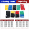 A variety of heat shrink tubing kits in yellow, blue, black, green, and red colors are displayed for shrinking applications.