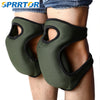 A pair of olive green soft foam kneepads worn on the knees of a person's legs.