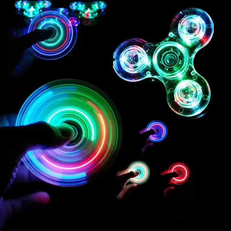 Hands manipulate glowing LED fidget spinners of various colors and shapes against a dark background.