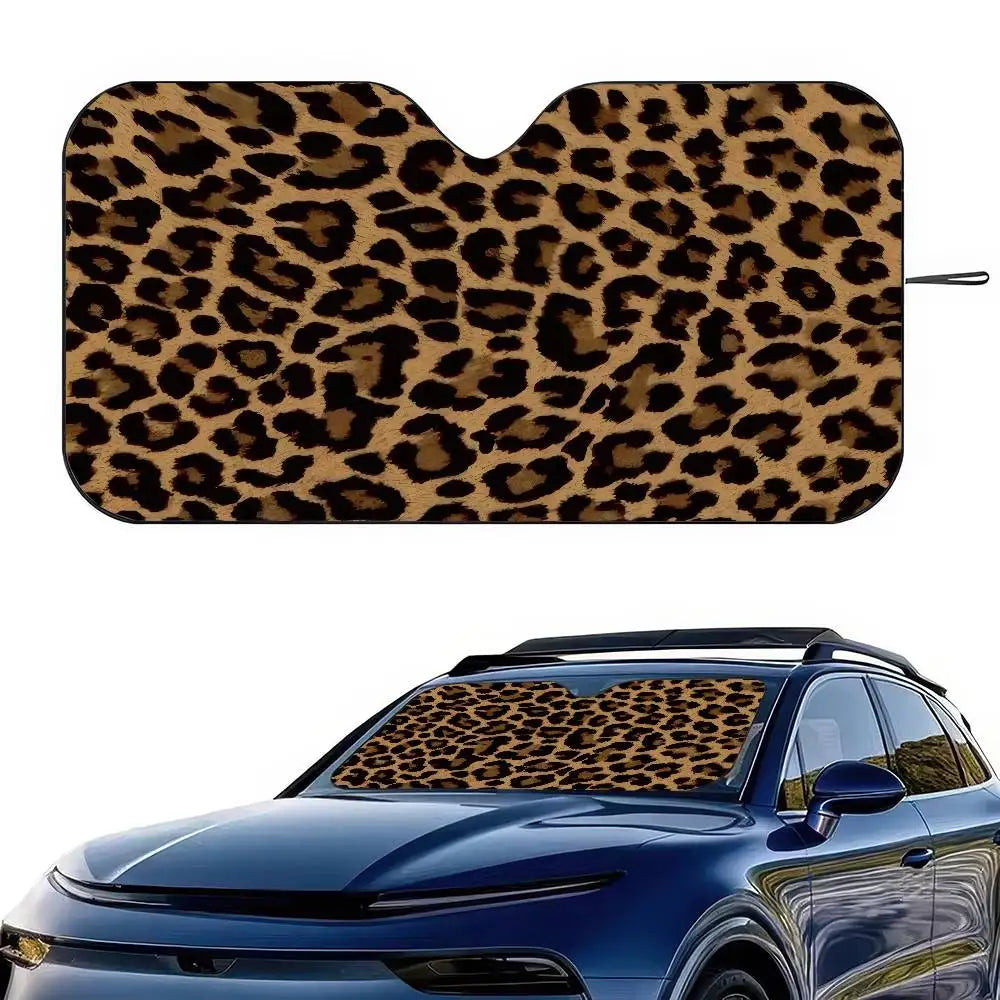 Leopard print car windshield sunshade covering the front glass of a blue car.