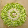 A circular arrangement of bright lime green microfiber spinning mop heads with white plastic bases.
