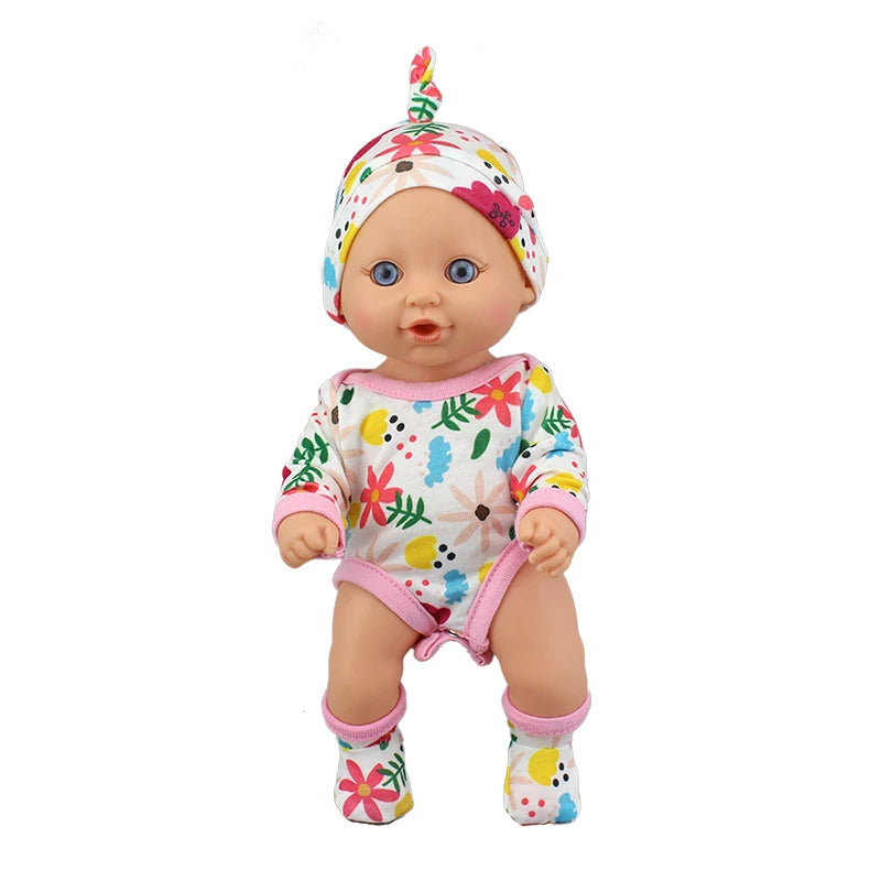 A baby doll wearing a floral jumpsuit outfit and matching headscarf.