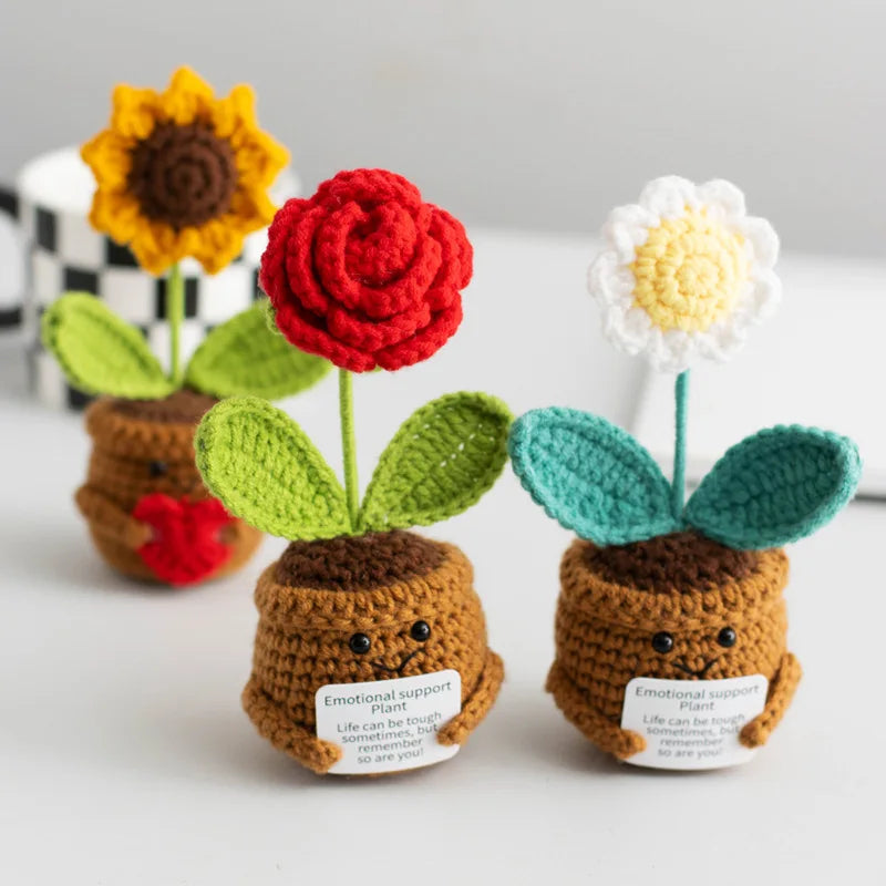 Handmade crochet positive energy plant dolls in various colors like yellow, red, and green.