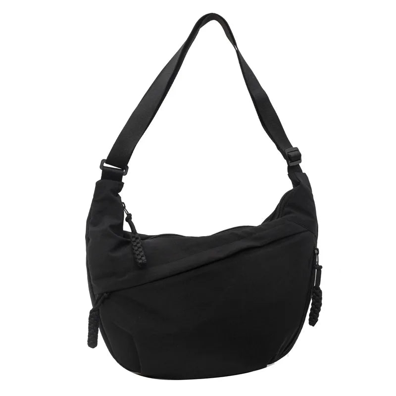 Black lightweight nylon crossbody bag with an adjustable strap.