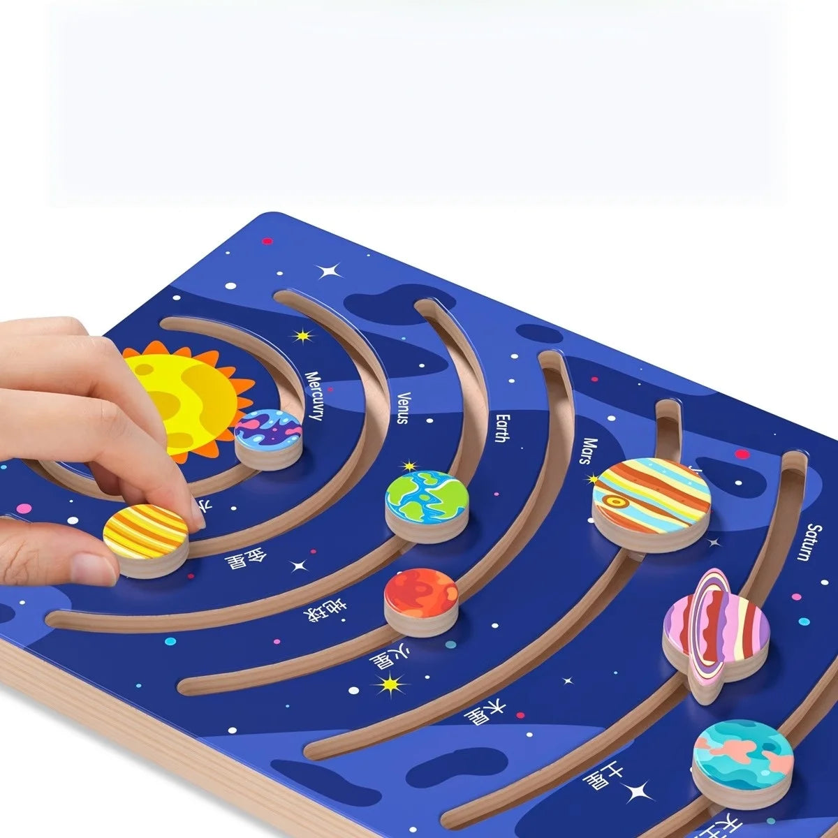 A hand places a wooden solar system puzzle piece onto a curved track on a blue board.