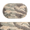 A ball of chunky chenille yarn with a mottled gray and cream color pattern.