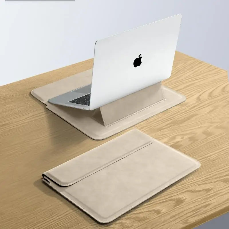 A silver laptop is placed inside a beige slim protective sleeve case on a wooden table.