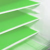 A close-up view of a white refrigerator shelf with bright green textured liners.