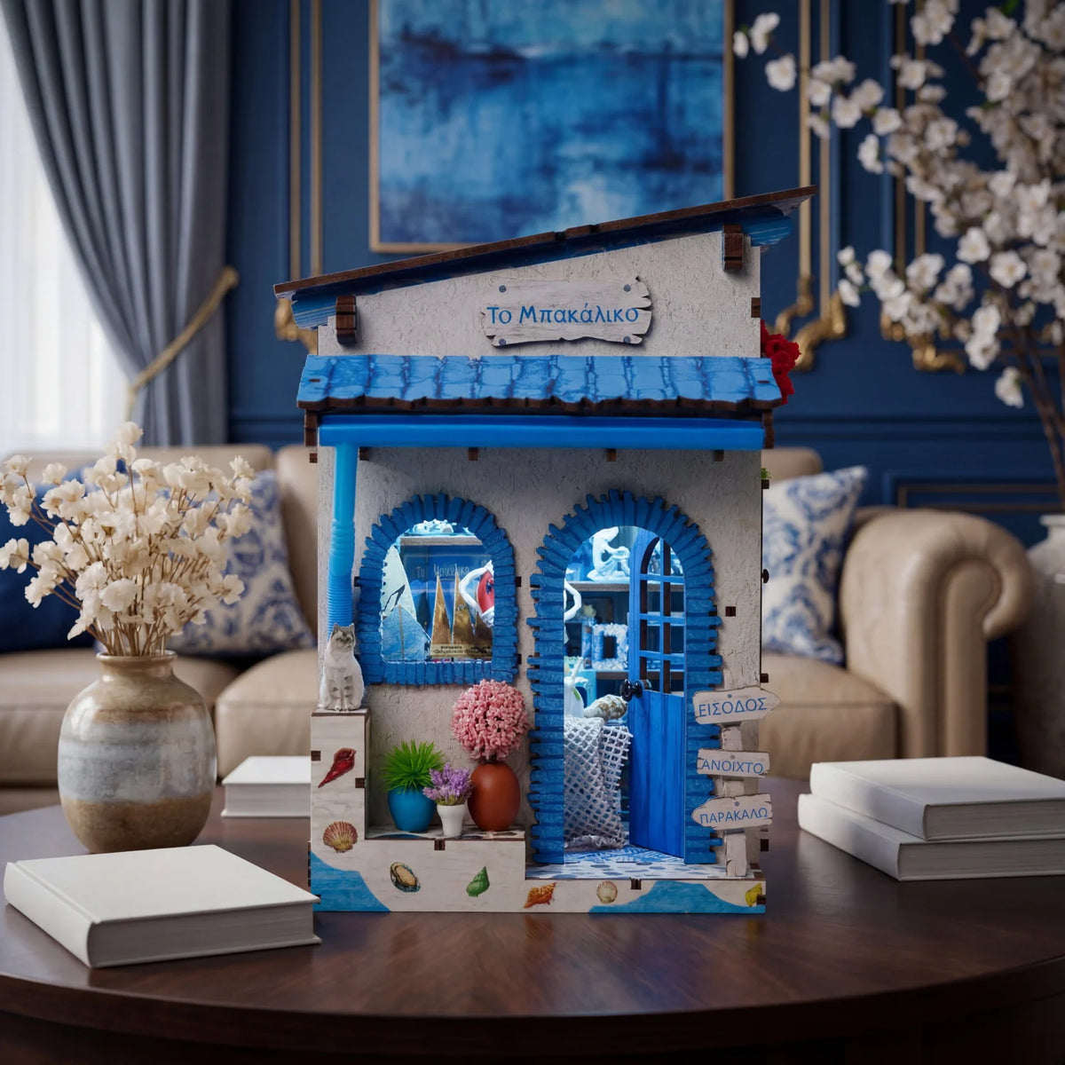 A wooden DIY book nook kit featuring a miniature seaside scene with blue and white accents.
