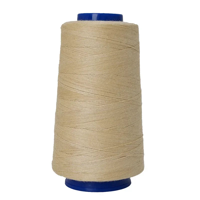A spool of beige heavy-duty waterproof bonded polyester thread with a blue core.