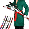 A person wearing a green gi holds a 41-inch katana cosplay sword with a red wrapping.