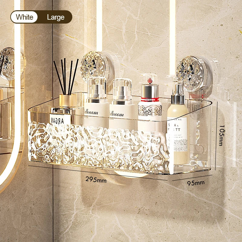 A clear wall-mounted storage basket with a water ripple design holds several white cosmetic bottles and brushes.