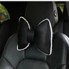 Black silky bow car headrest pillow with white trim and waist cushion set.