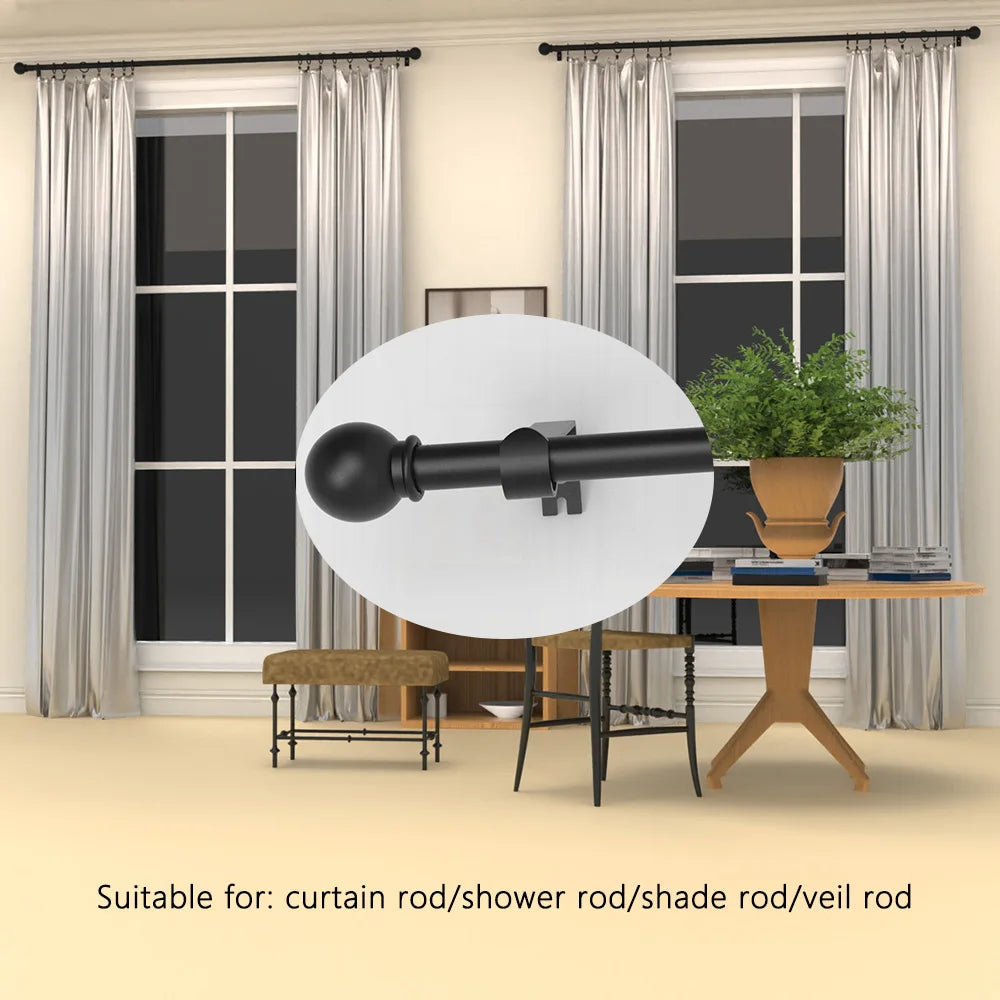A black curtain rod with spherical finials is displayed in a bright room next to a window.