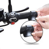 Close-up of a black motorcycle throttle assist cruise control grip being held by a hand.