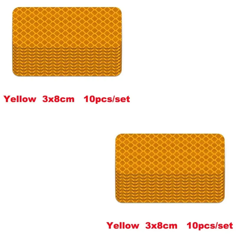 A set of ten yellow 3x8cm high-visibility reflective strip stickers for car safety.