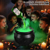 Children surrounding an LED fog-mist Halloween cauldron with a green potion effect