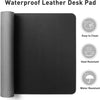 A black waterproof leather desk pad with icons indicating it is easy to clean, heat resistant, and water resistant.