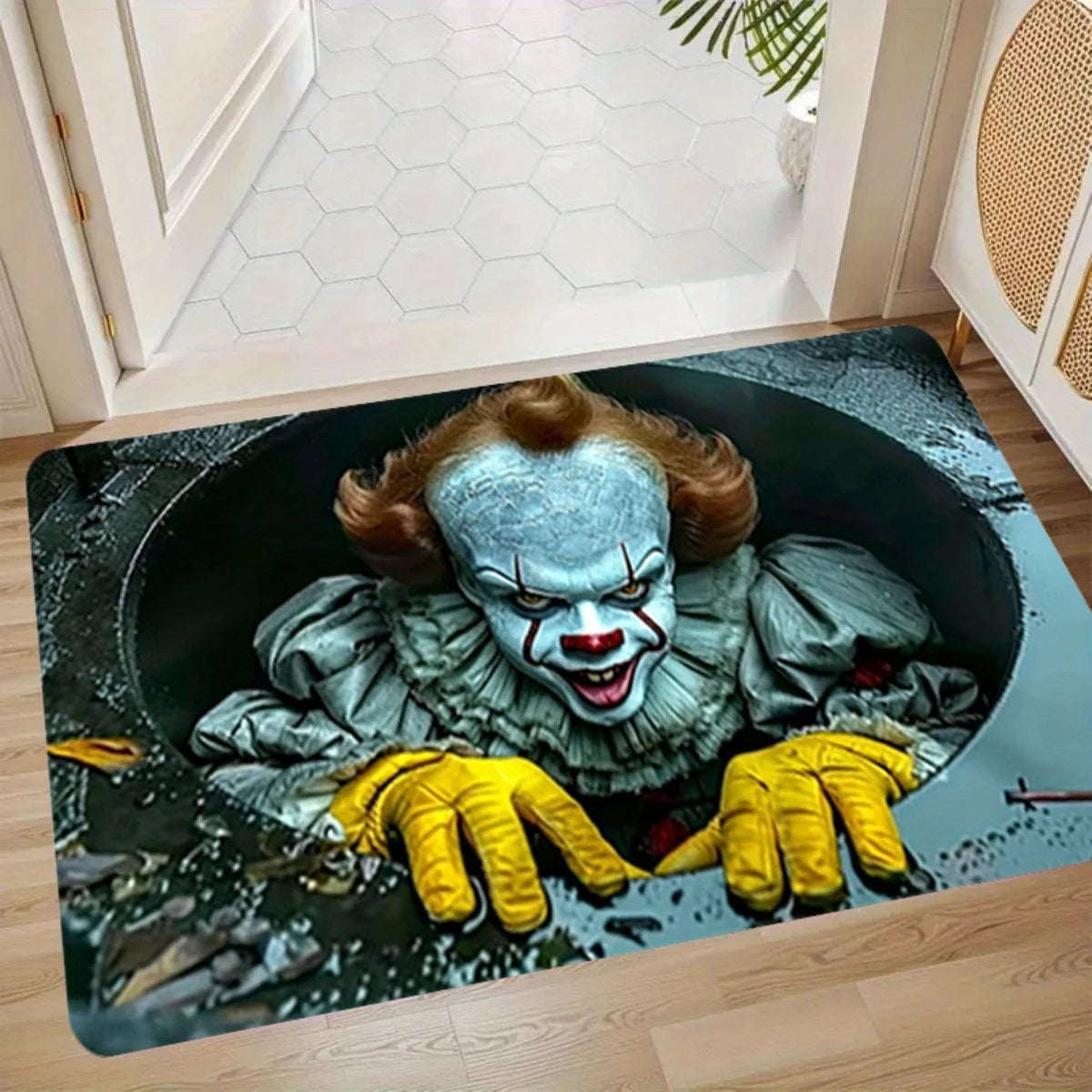A door mat featuring a stylized image of the Joker character with gray skin and yellow gloves.