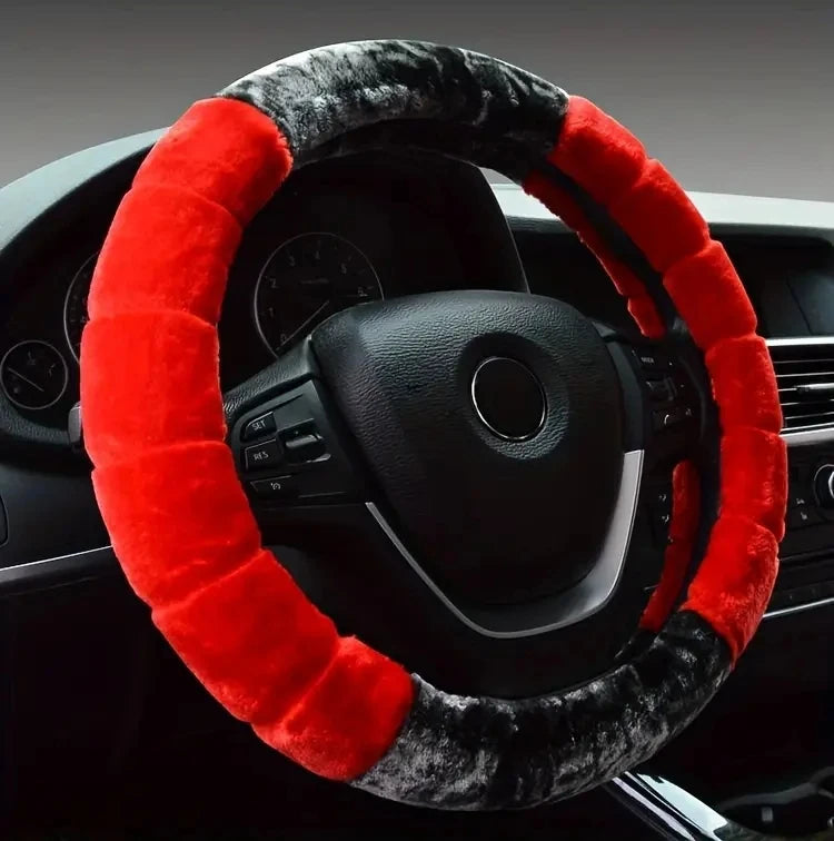 A black steering wheel covered with a red and gray plush material.