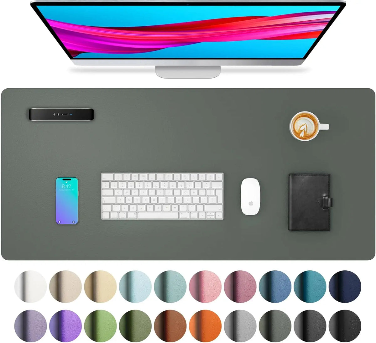 A computer monitor displaying colorful abstract lines, a blue smartphone, a white wireless mouse, and a black leather noteboo