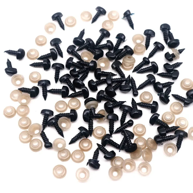 A pile of black safety noses with white washers for crafting and stuffed animals