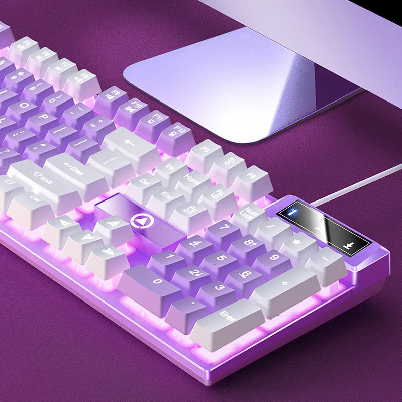 A purple wired low-profile gaming keyboard with a numeric keypad is shown on a purple surface.
