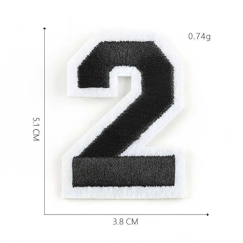 A black and white iron-on 3D number patch shaped like the numeral 2.