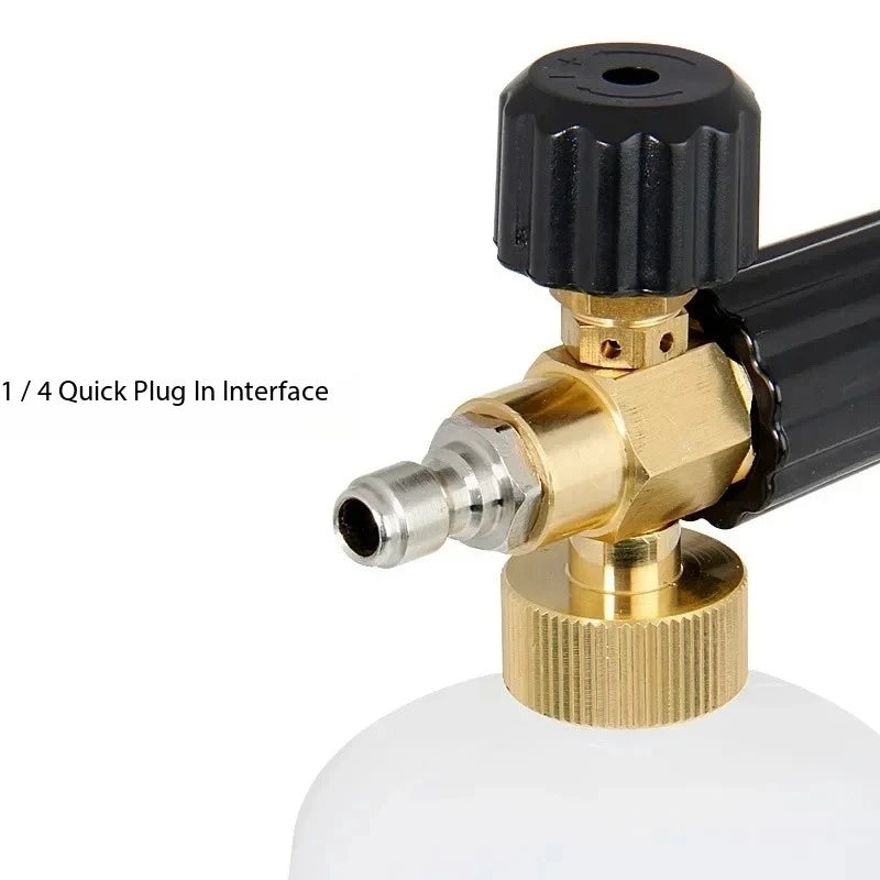 A close-up view of a black high-pressure foam lance connector with a brass fitting and a threaded nozzle.