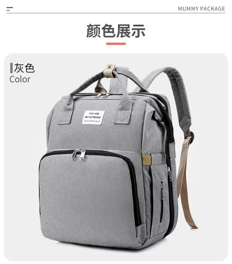 A gray backpack for a mummy package showing the color display.