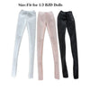A set of three sheer stockings in white, pink, and black for fashion dolls