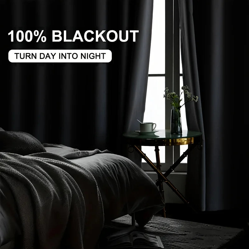 A dark gray blackout curtain panel is shown covering a window, with a bedside table and bedding visible.