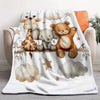 A cozy flannel blanket featuring illustrations of a giraffe, an elephant, and a teddy bear on a white background.