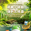 A colorful jumping frog catch game featuring plastic frogs, a green frog character, and an orange frog in a natural outdoor s