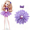 A fashion doll with long blonde hair wearing a purple dress and accessories, alongside a separate purple fabric flower.