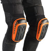 A pair of black knee pads with orange accents and textured soles are shown on a person's leg.