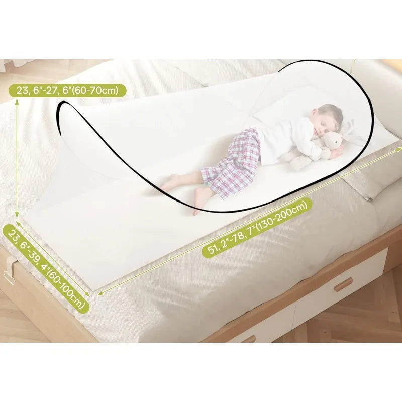 A child is lying on a bed with an instant pop-up mosquito net installed over the bedding.