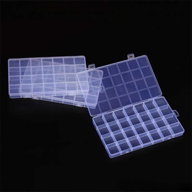 A transparent multi-compartment storage box with fixed dividers shown against a black background.