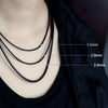 Close-up of black waxed cord rope for jewelry making showing three different thicknesses: 1.5mm, 2.0mm, and 3.0mm.