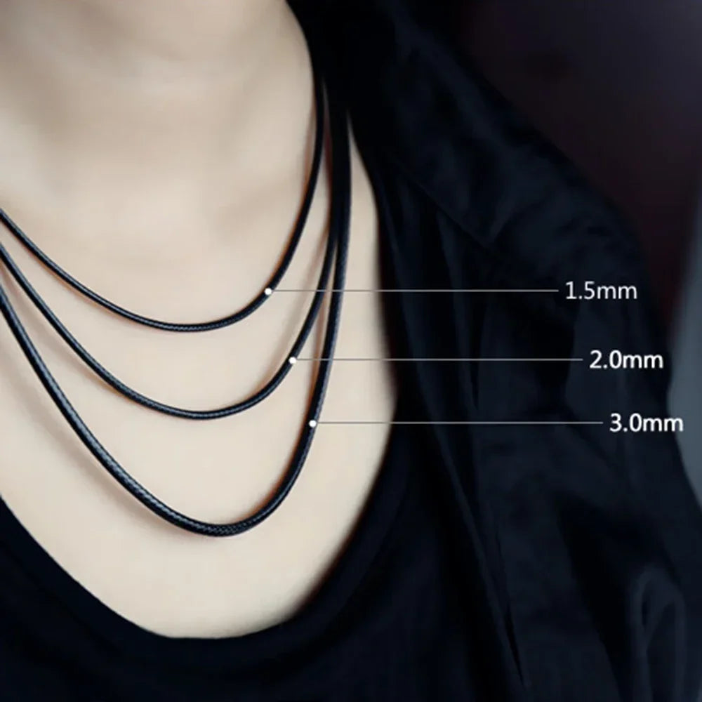Close-up of black waxed cord rope for jewelry making showing three different thicknesses: 1.5mm, 2.0mm, and 3.0mm.