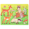 A wooden jigsaw puzzle featuring various woodland animals including a fox, raccoon, and a rabbit on a green background.