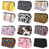 A collection of colorful and patterned cosmetic bags made of neoprene for travel makeup organization.